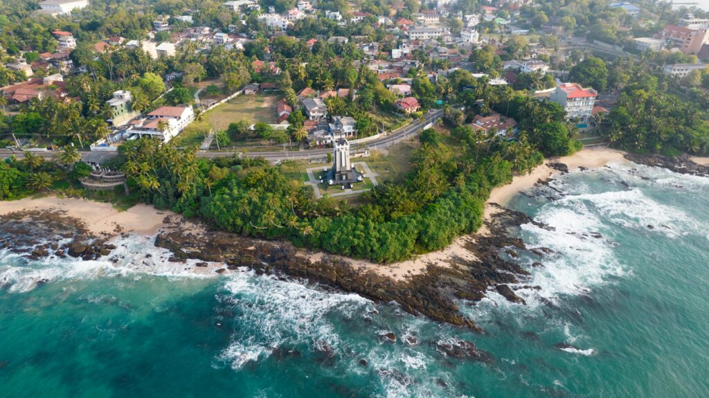 Stunning aerial view of Tangalle's coastline with lush greenery and clear ocean waters in Sri Lanka.